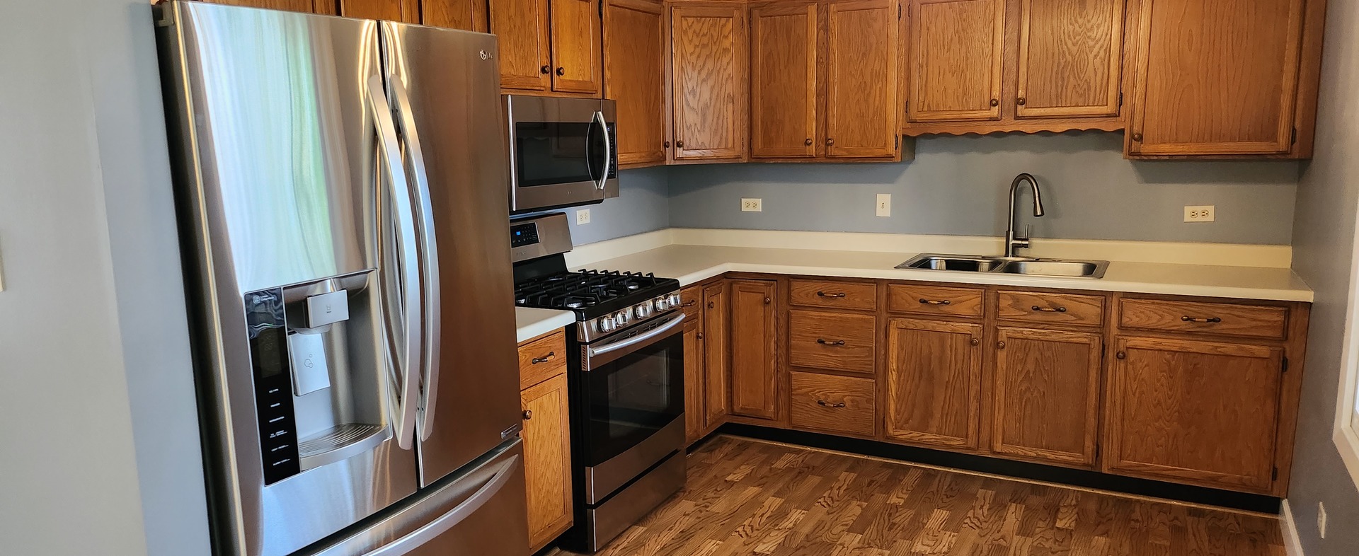 7306 West Mathews Drive Frankfort, IL 60423 - Photo 5 of 26 a kitchen with stainless steel appliances granite countertop a refrigerator sink and cabinets