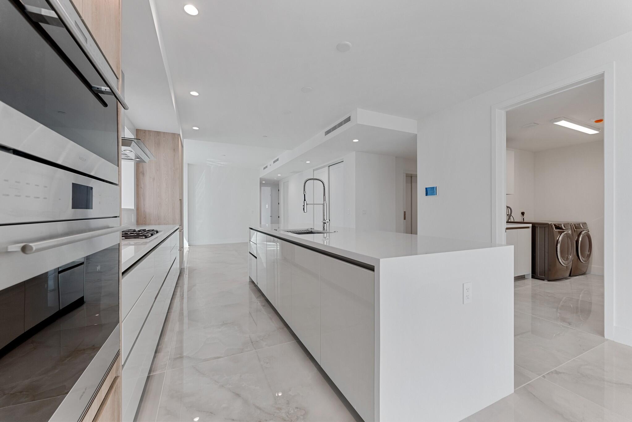 485 East Royal Palm Road, Unit 204 Boca Raton, FL 33432 - Photo 13 of 70 a kitchen with granite countertop cabinets and refrigerator