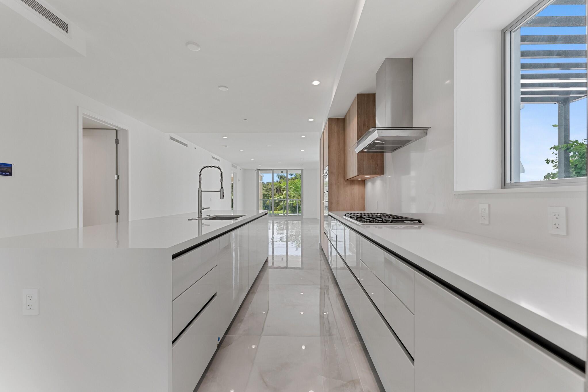 485 East Royal Palm Road, Unit 204 Boca Raton, FL 33432 - Photo 15 of 70 a kitchen with stainless steel appliances granite countertop a stove a sink and a refrigerator