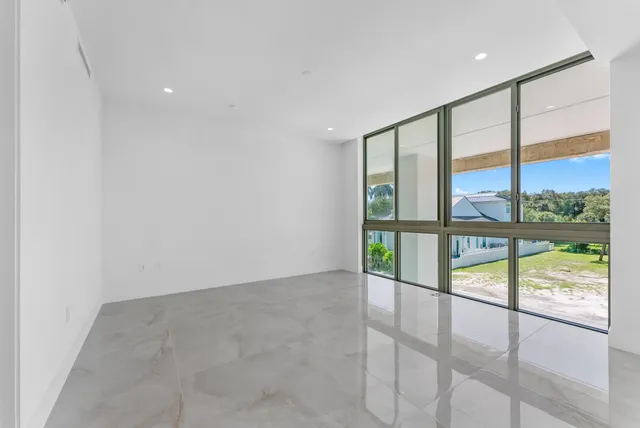 a view of a livingroom with furniture and window