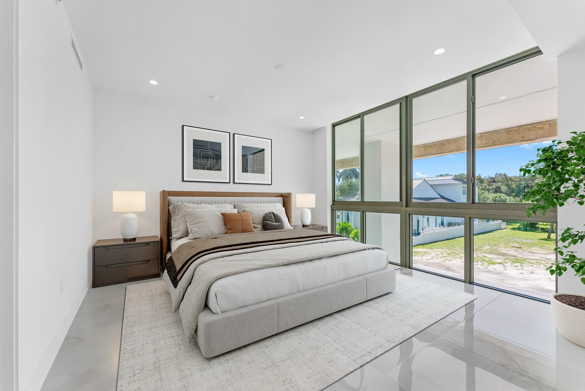 485 East Royal Palm Road, Unit 204 Boca Raton, FL 33432 - Photo 29 of 70 a bedroom with a large bed and a large window