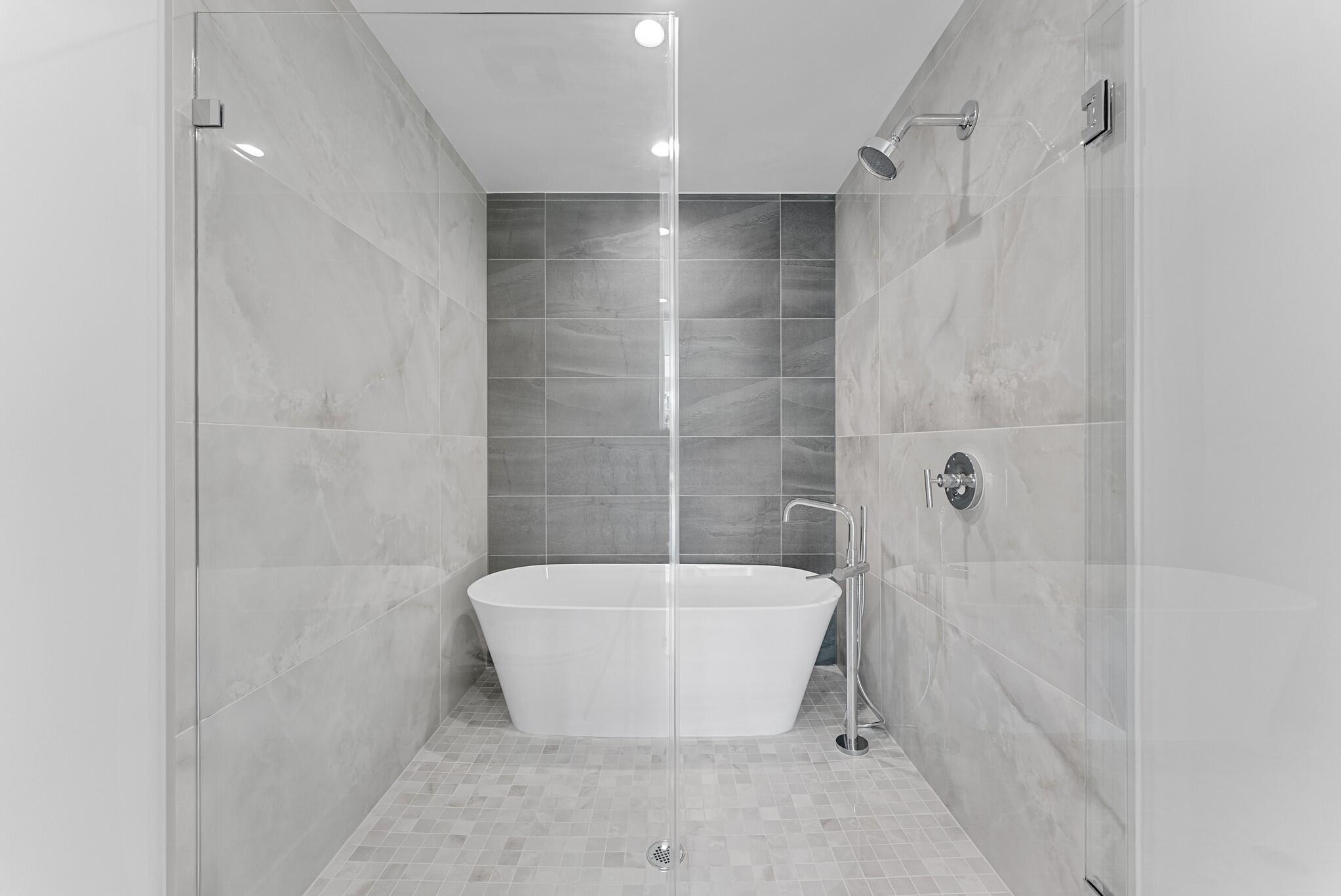 485 East Royal Palm Road, Unit 204 Boca Raton, FL 33432 - Photo 31 of 70 a bathroom with a bathtub and shower