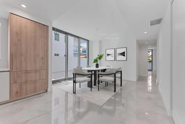 a bathroom with a granite countertop sink a toilet and shower