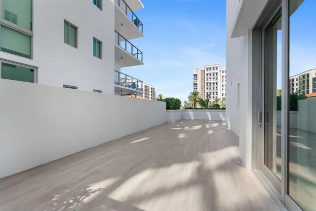 a room with lots of furniture and a large window