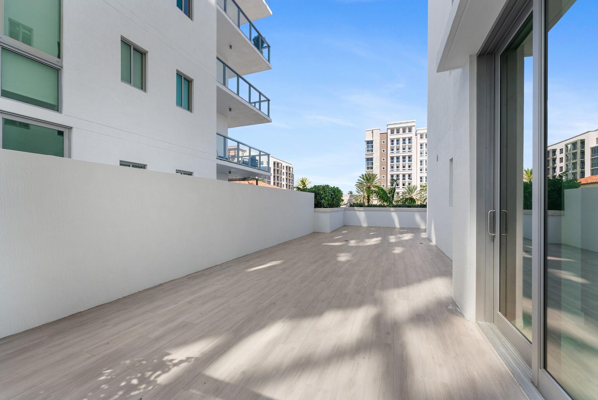 485 East Royal Palm Road, Unit 204 Boca Raton, FL 33432 - Photo 40 of 70 a view of a street with a building in the background