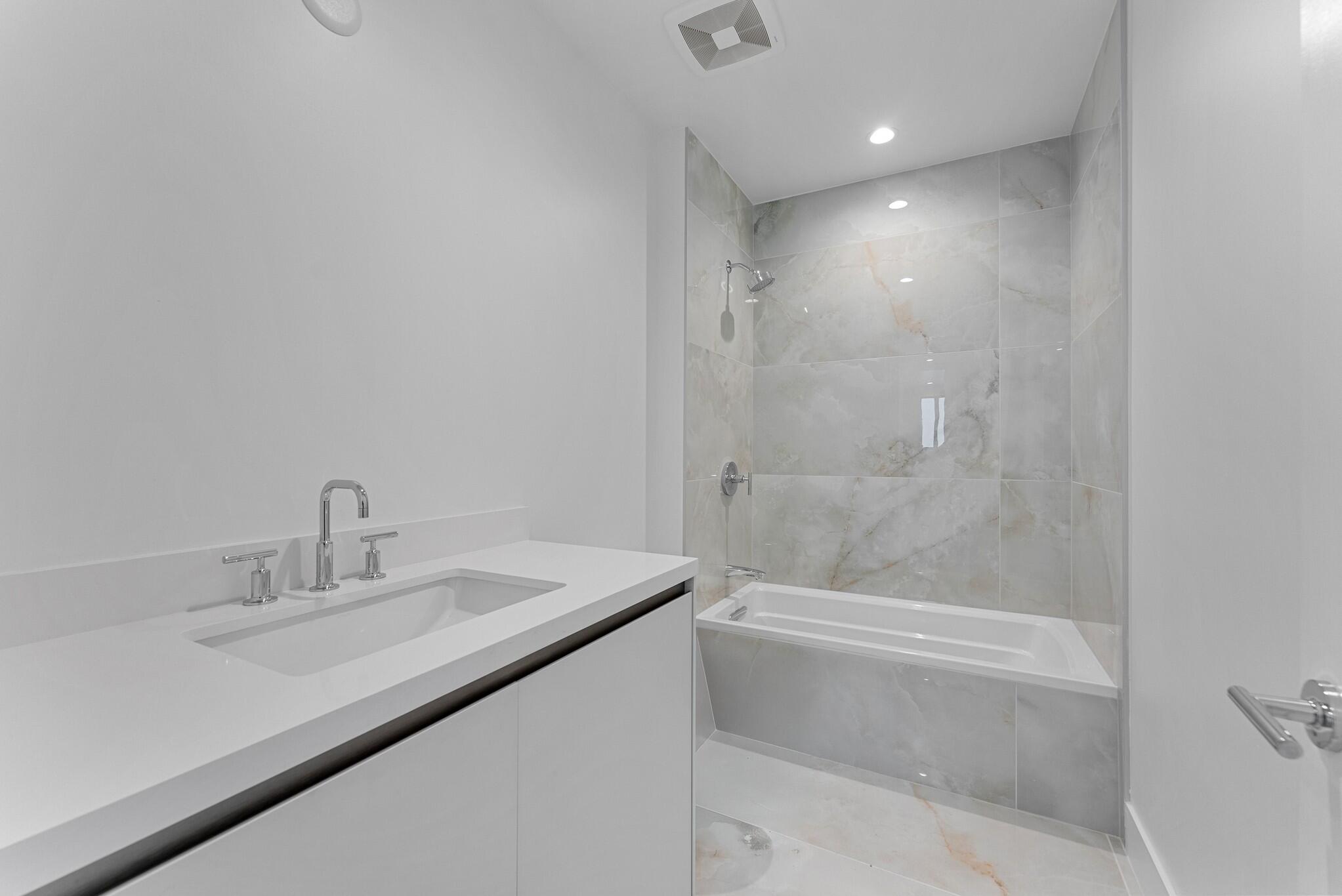485 East Royal Palm Road, Unit 204 Boca Raton, FL 33432 - Photo 50 of 70 a bathroom with a sink a toilet and shower