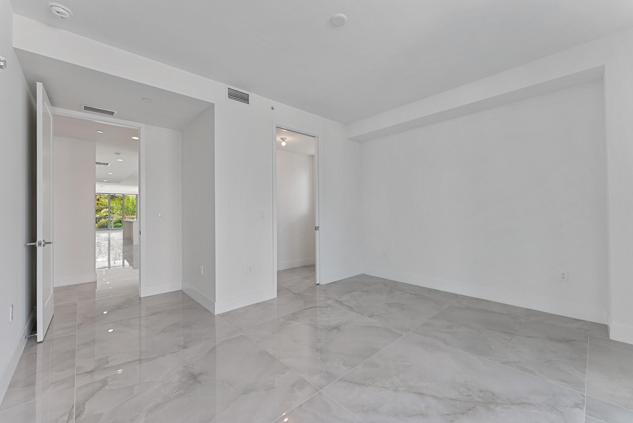 485 East Royal Palm Road, Unit 204 Boca Raton, FL 33432 - Photo 51 of 70 an empty room with mirror and a window