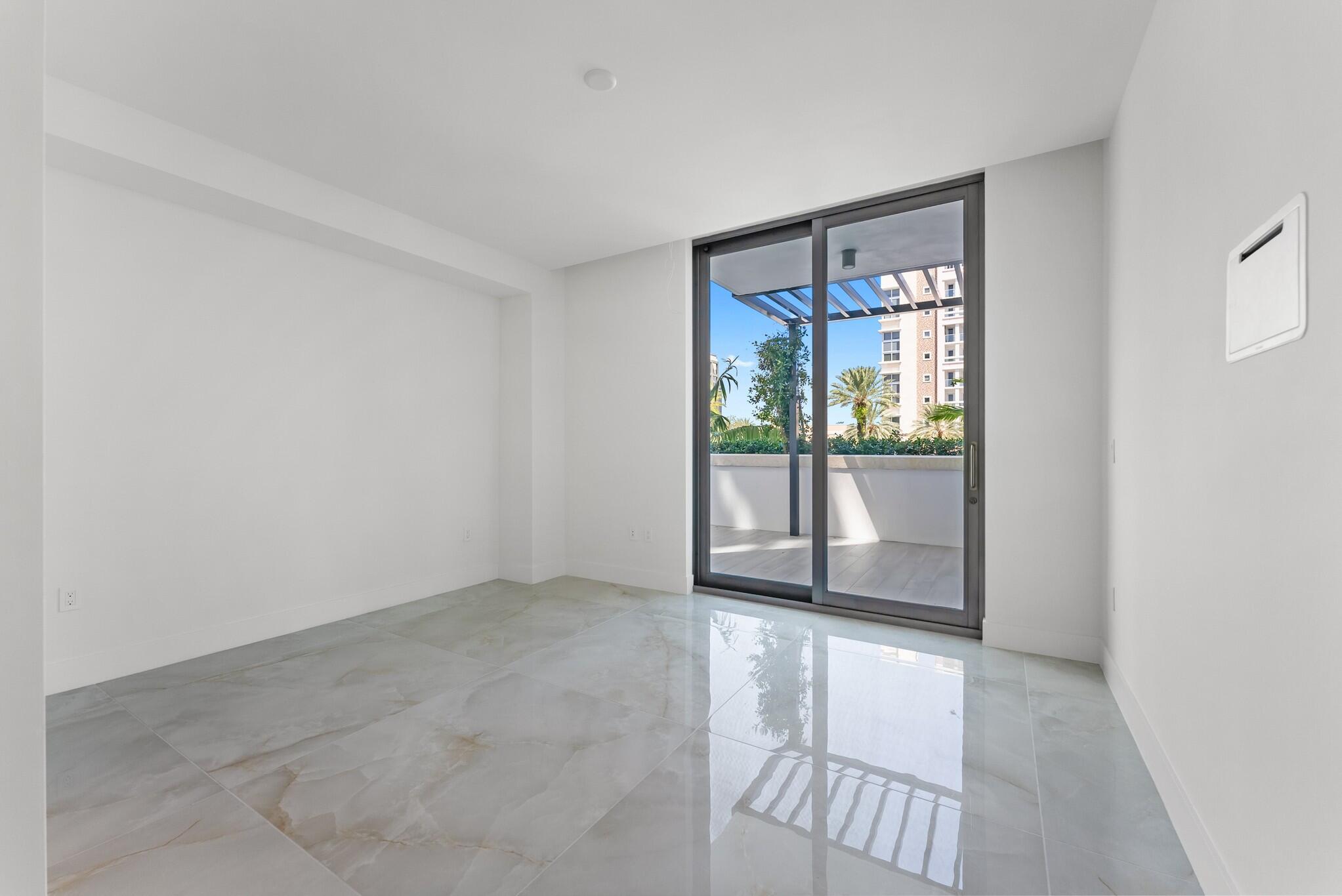 485 East Royal Palm Road, Unit 204 Boca Raton, FL 33432 - Photo 52 of 70 an empty room with windows