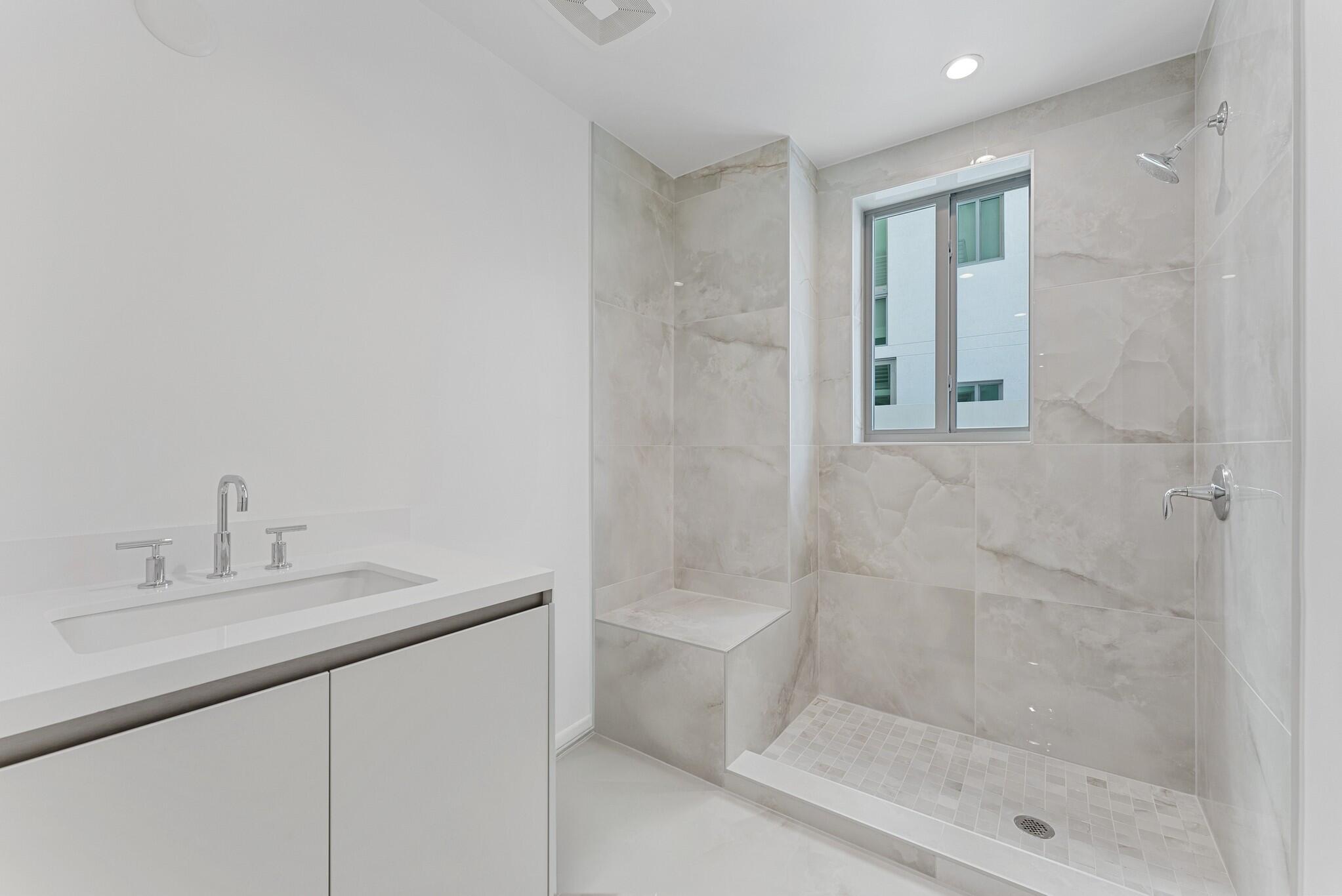 485 East Royal Palm Road, Unit 204 Boca Raton, FL 33432 - Photo 54 of 70 a bathroom with a granite countertop sink a toilet and shower