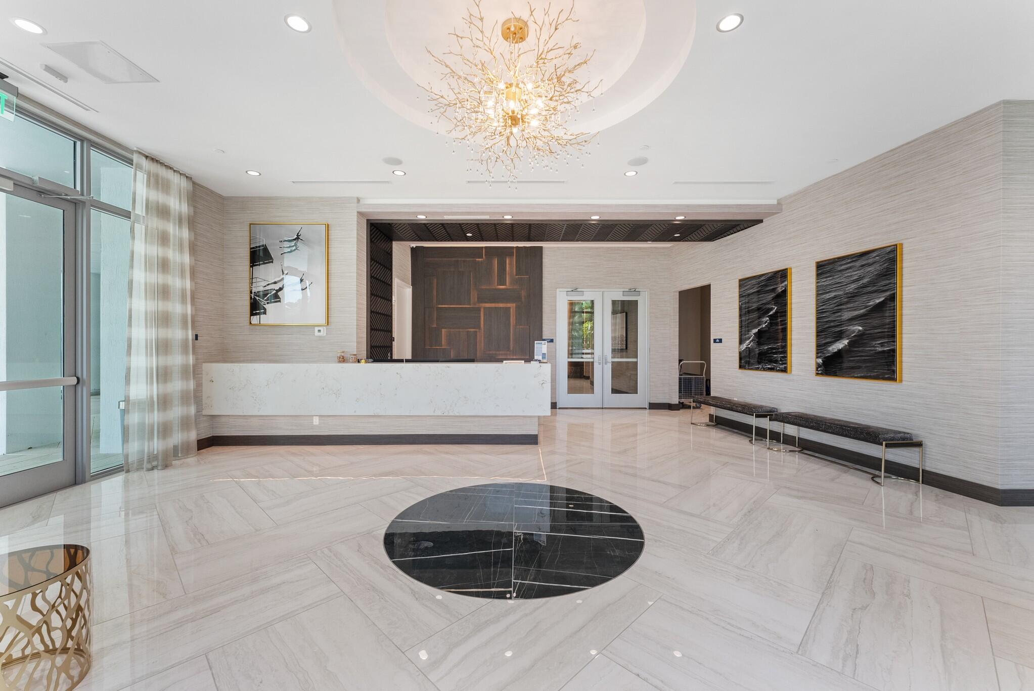 485 East Royal Palm Road, Unit 204 Boca Raton, FL 33432 - Photo 55 of 70 a view of a livingroom with a fireplace furniture and a chandelier