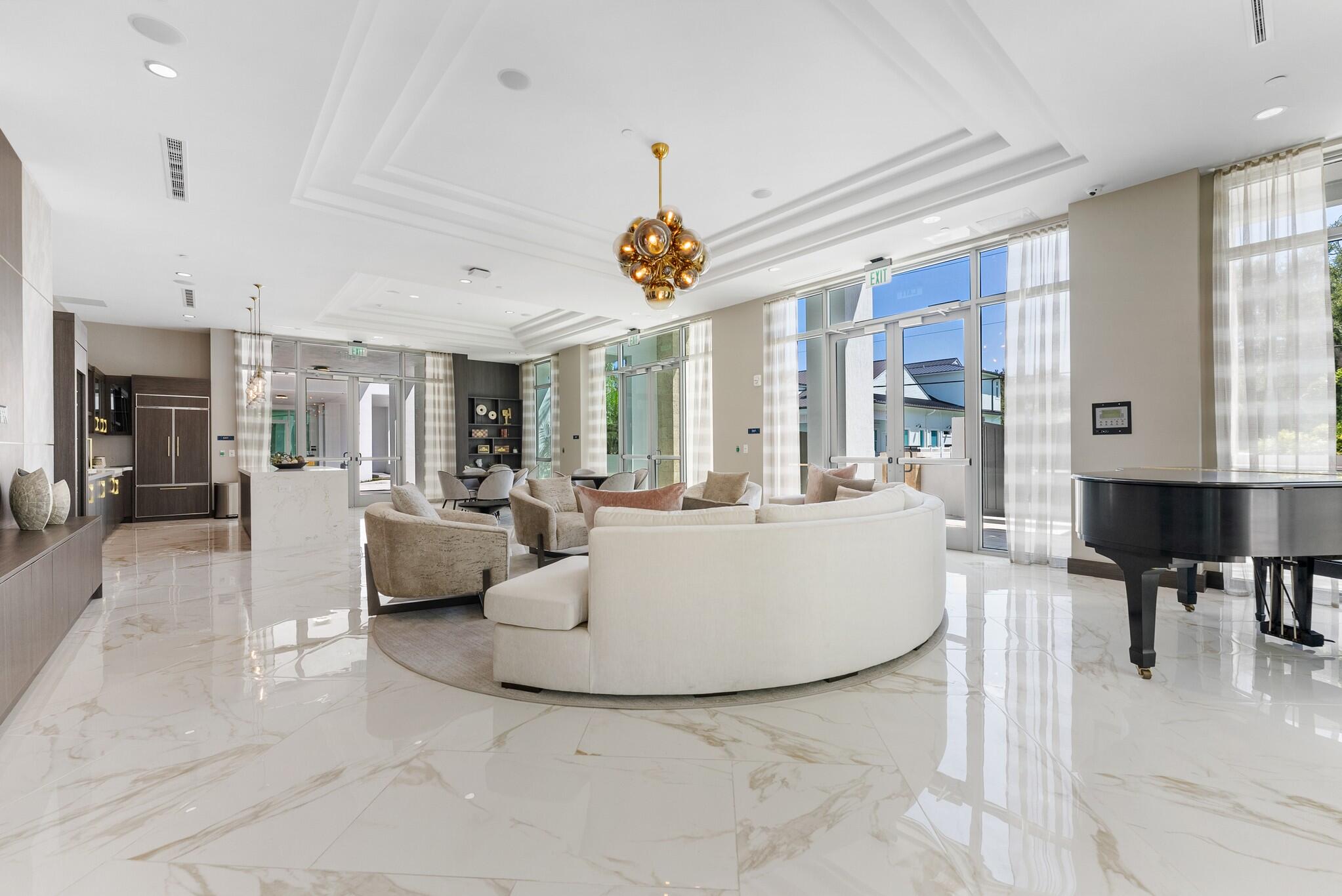 485 East Royal Palm Road, Unit 204 Boca Raton, FL 33432 - Photo 59 of 70 a living room with couches and kitchen view with wooden floor