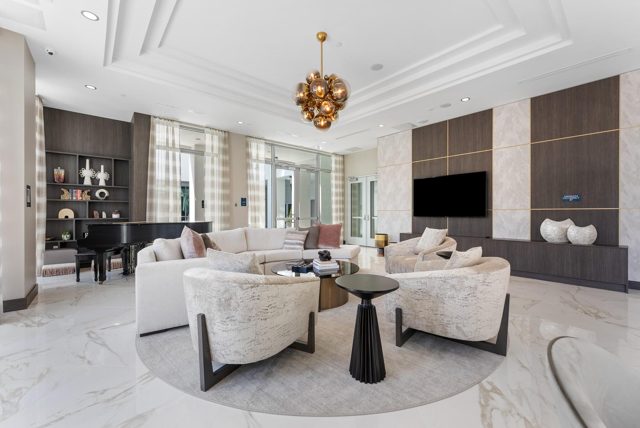 485 East Royal Palm Road, Unit 204 Boca Raton, FL 33432 - Photo 60 of 70 a living room with fireplace furniture and a flat screen tv