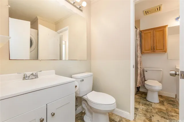 a bathroom with a sink toilet and mirror