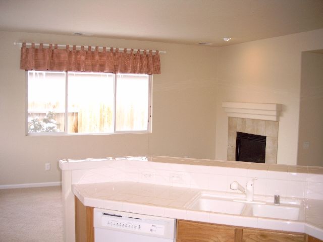 10405 Summershade Lane Reno, NV 89521 - Photo 3 of 6 a bathroom with a sink a vanity and a large mirror