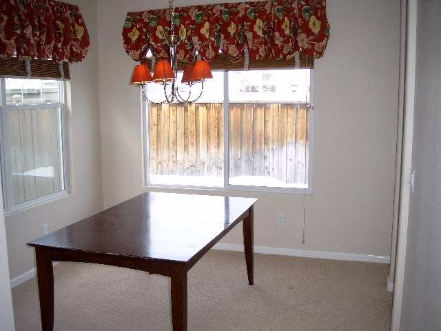 10405 Summershade Lane Reno, NV 89521 - Photo 4 of 6 a view of an empty room with a window