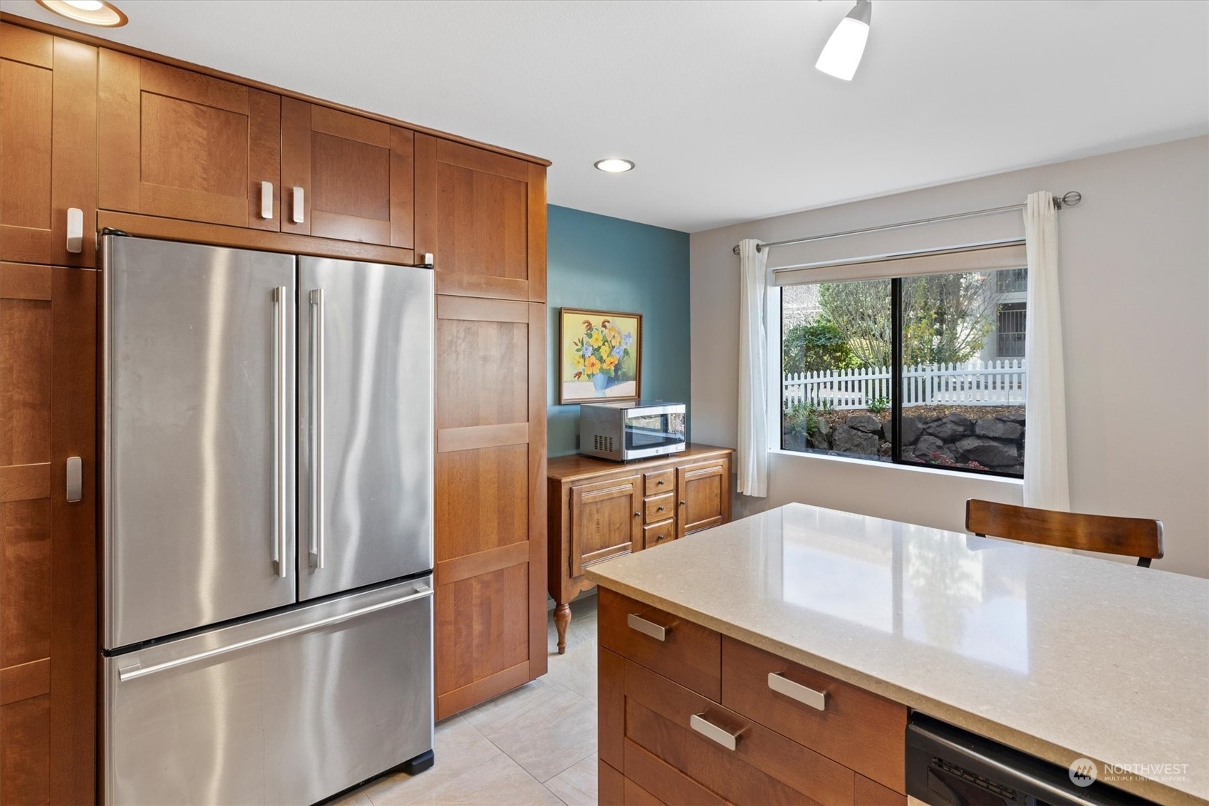 201 3rd Avenue North, Unit 102 Edmonds, WA 98020 - Photo 13 of 39 a kitchen with a refrigerator and a sink