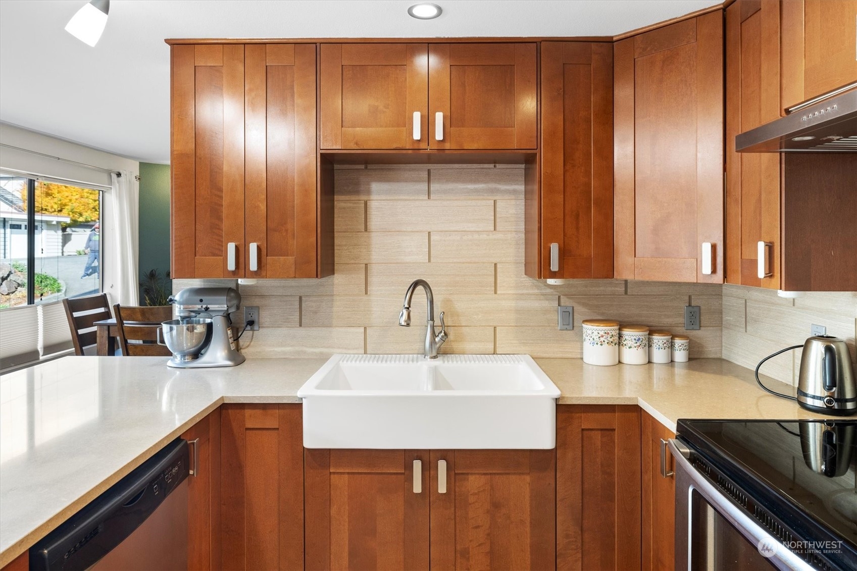 201 3rd Avenue North, Unit 102 Edmonds, WA 98020 - Photo 16 of 39 a kitchen with a sink and a refrigerator