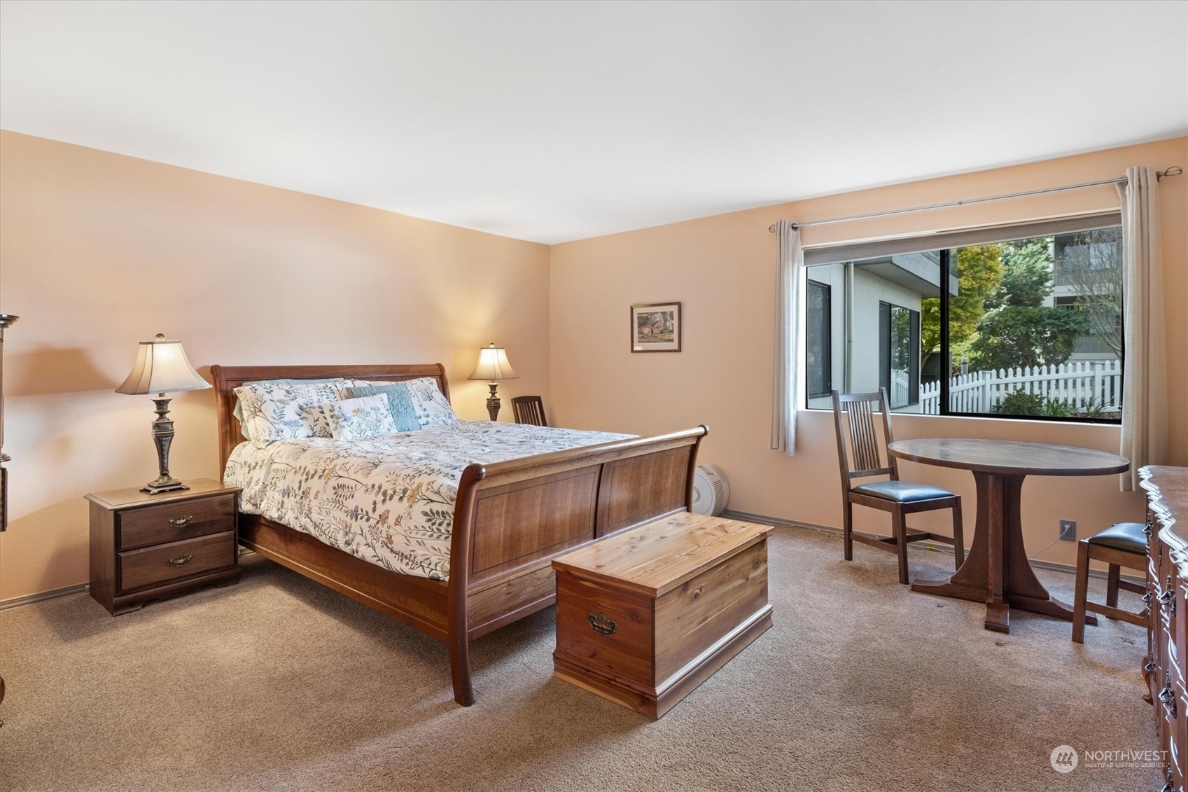 201 3rd Avenue North, Unit 102 Edmonds, WA 98020 - Photo 17 of 39 a bedroom with a bed chair and a large window