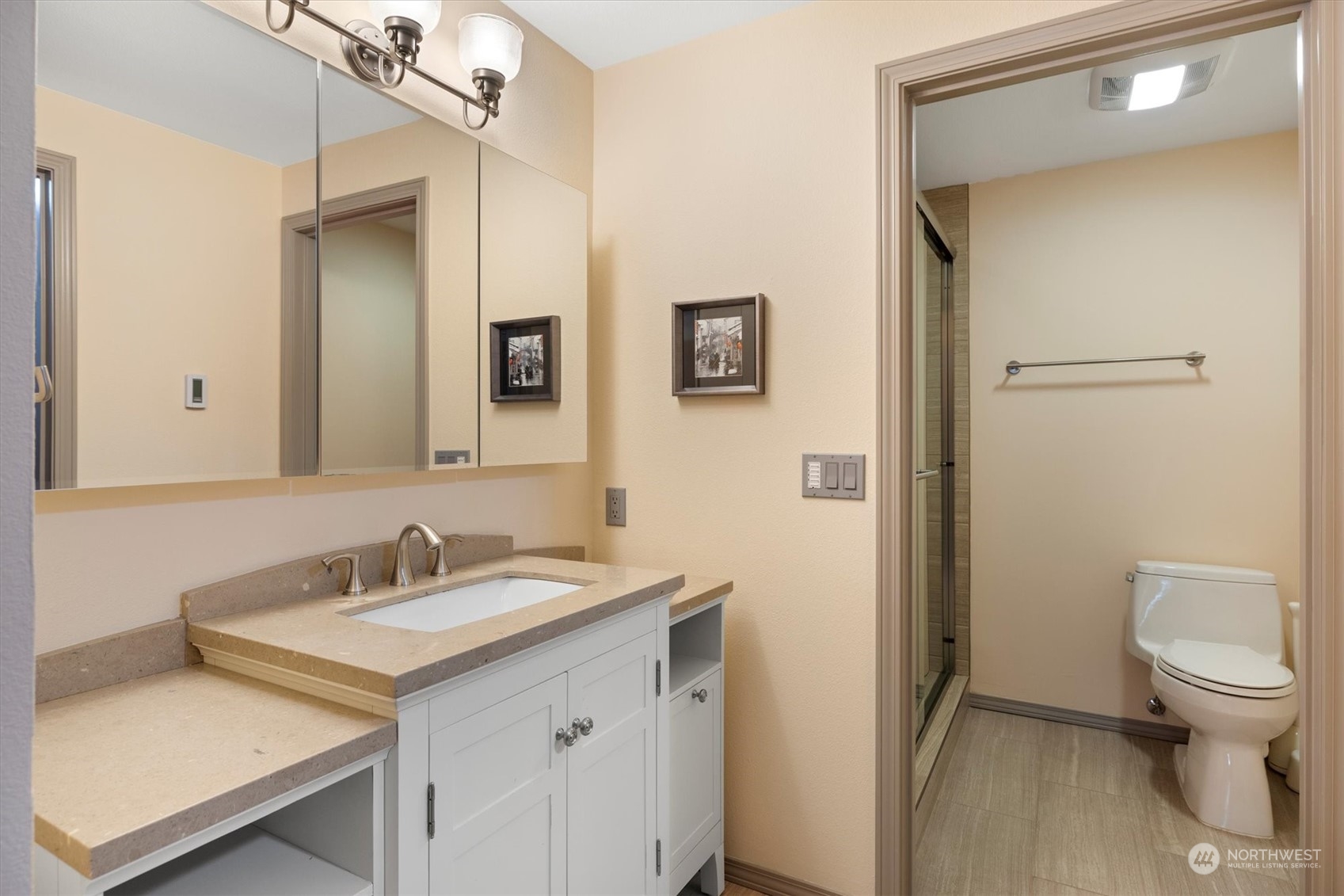 201 3rd Avenue North, Unit 102 Edmonds, WA 98020 - Photo 19 of 39 a bathroom with a sink toilet and shower