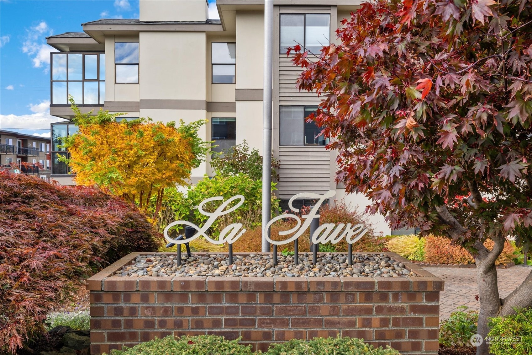 201 3rd Avenue North, Unit 102 Edmonds, WA 98020 - Photo 3 of 39 a front view of a house with garden