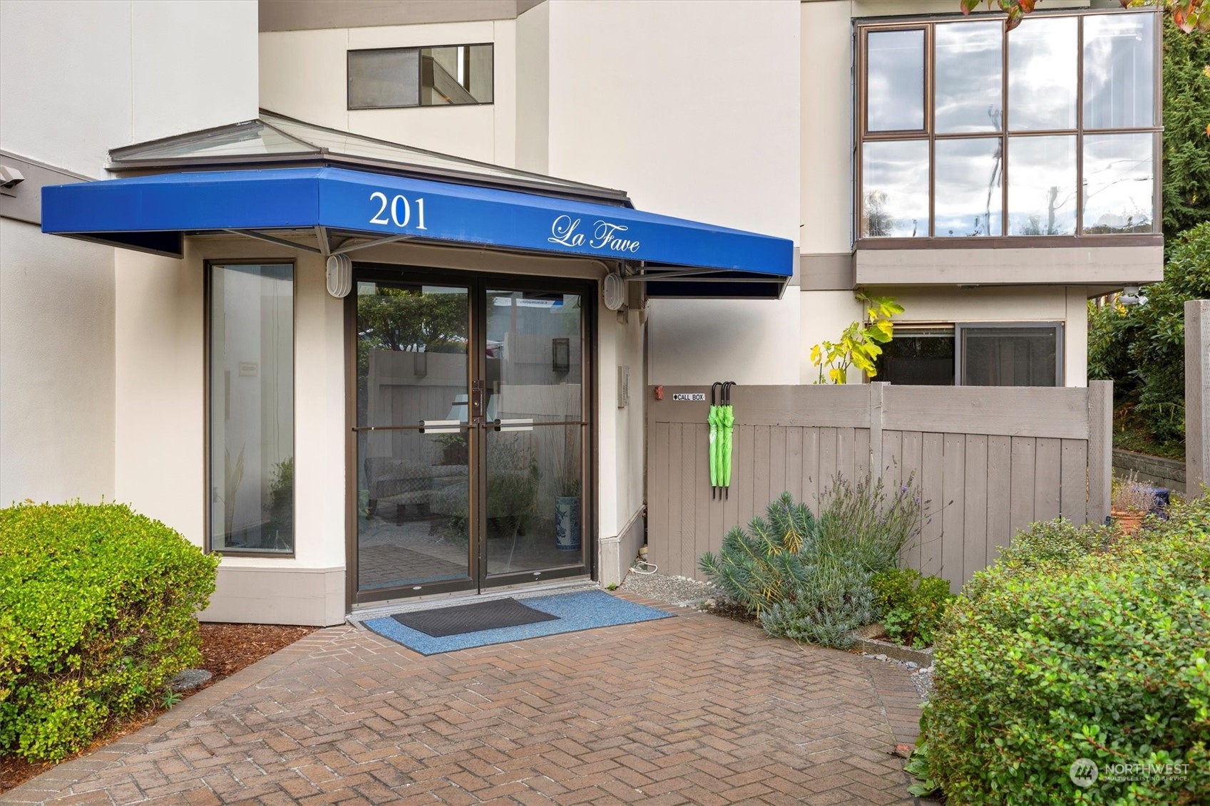 201 3rd Avenue North, Unit 102 Edmonds, WA 98020 - Photo 4 of 39 a wooden door with a glass door