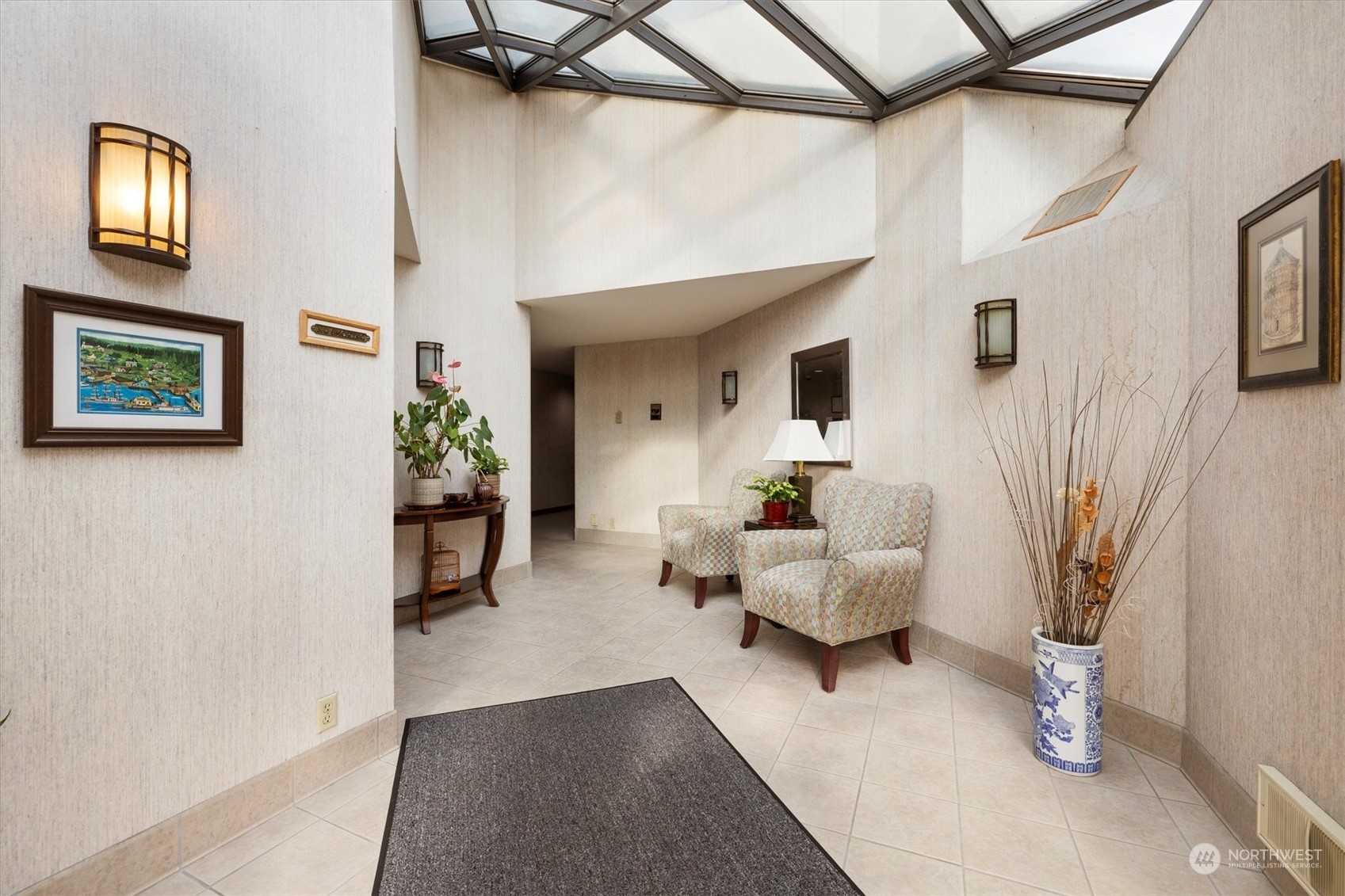 201 3rd Avenue North, Unit 102 Edmonds, WA 98020 - Photo 5 of 39 a living room with furniture and a potted plant