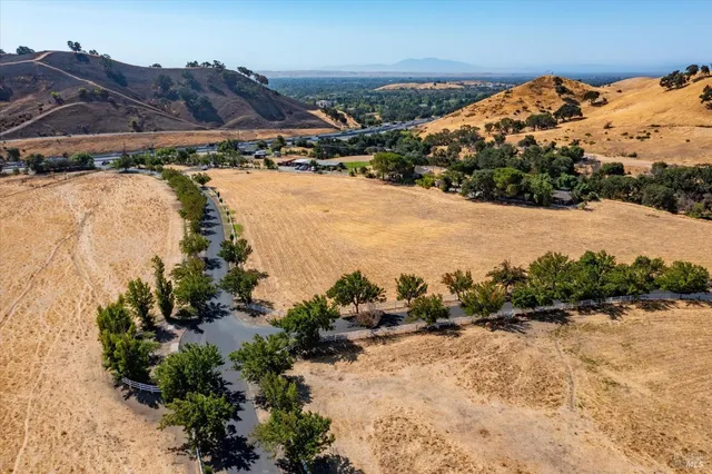 a view of wooden floor and a bathroom