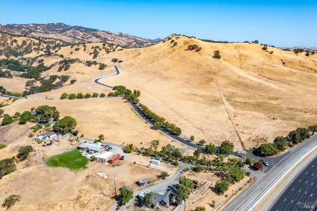 a view of a large mountain with a snow in the ocean