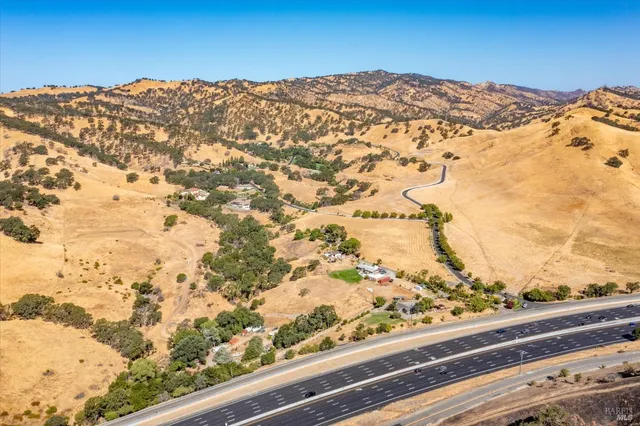 a view of a yard with a mountain