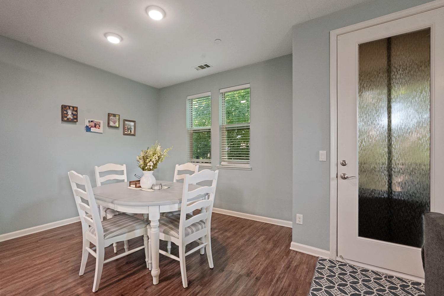 140 Ivy Avenue, Unit A5 Patterson, CA 95363 - Photo 9 of 26 a view of a dining room with furniture window and wooden floor