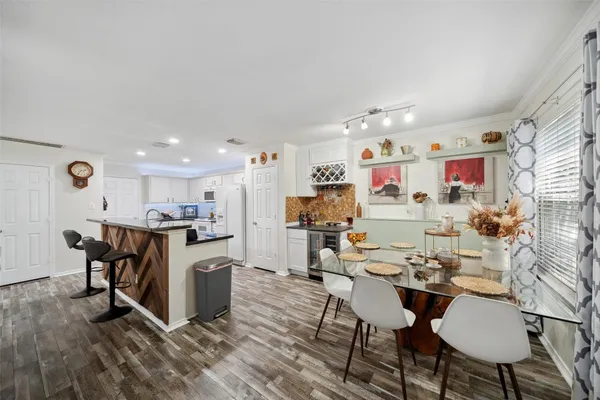 a view of kitchen with cabinets and wooden floor