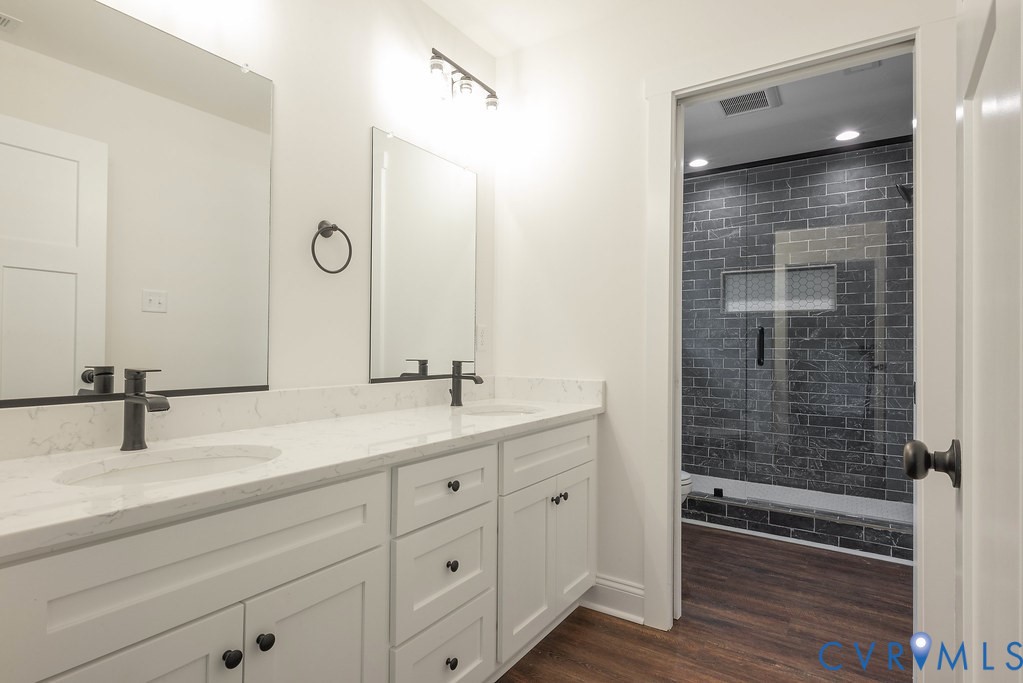 3844 Maidens Road Powhatan, VA 23139 - Photo 29 of 49 Bathroom featuring double vanity, a shower stall,