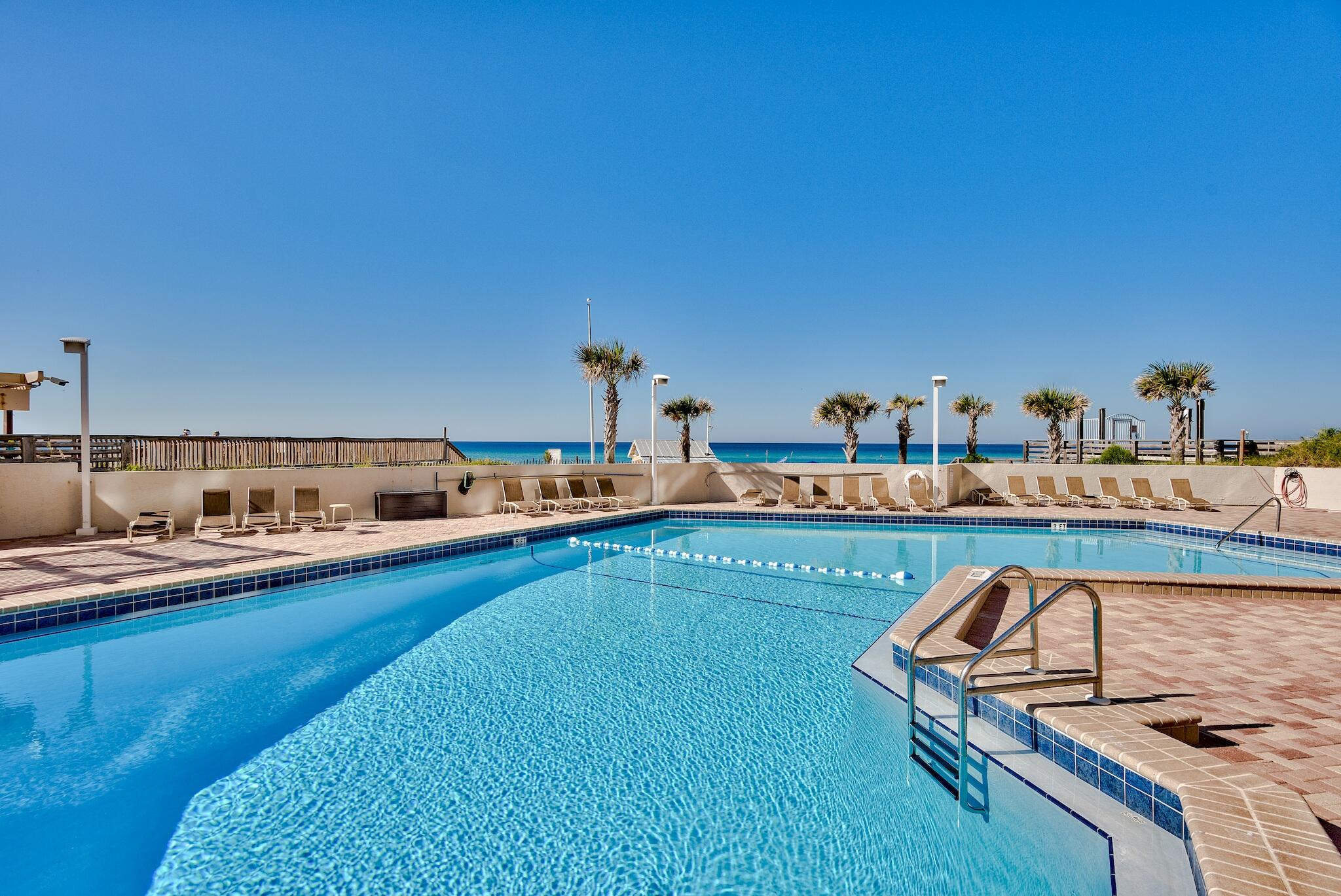 4361 Beachside 2, Unit 361 Miramar Beach, FL 32550 - Photo 29 of 29 a kitchen with stainless steel appliances kitchen island granite countertop a sink and cabinets