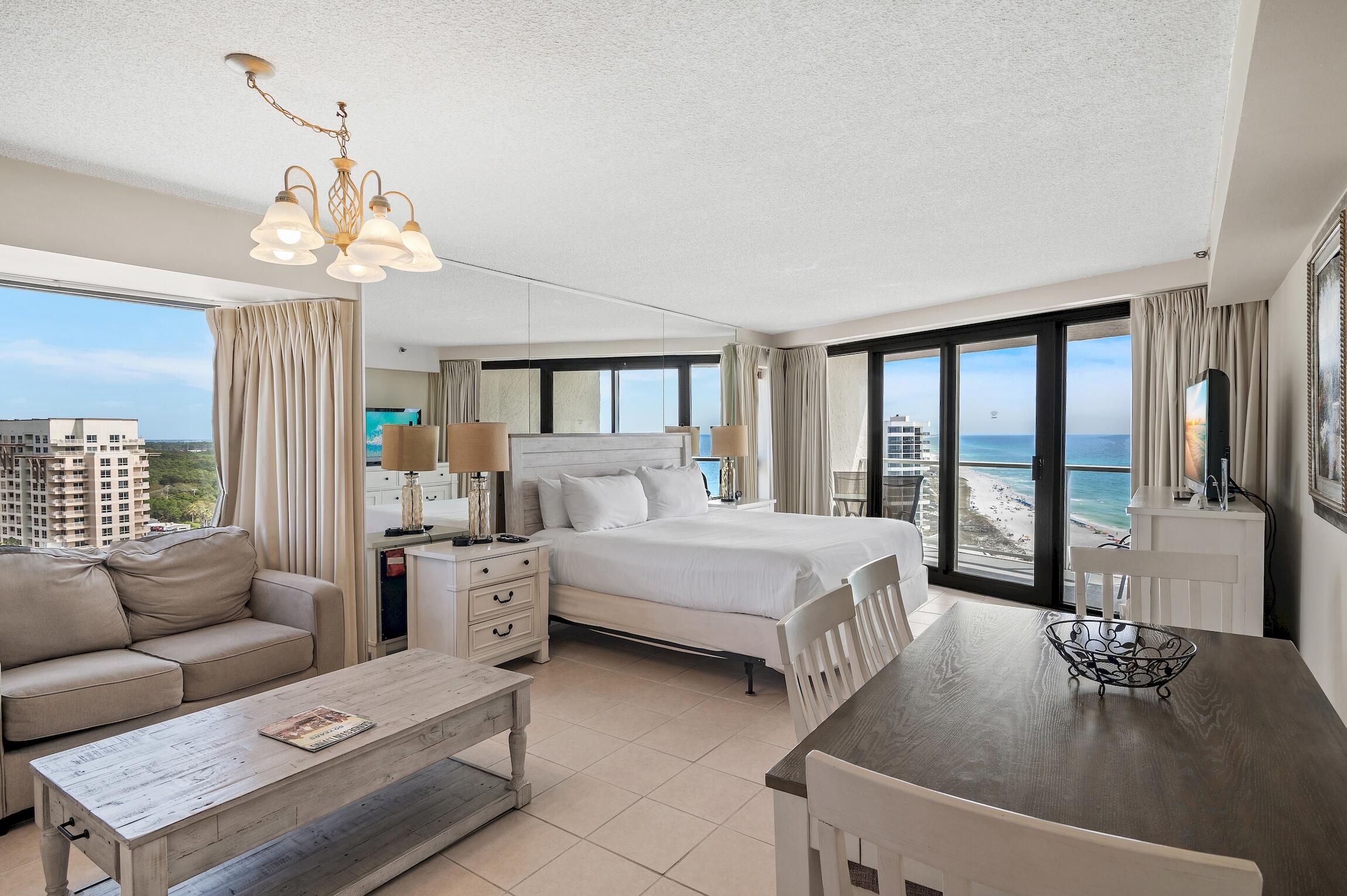 4361 Beachside 2, Unit 361 Miramar Beach, FL 32550 - Photo 8 of 29 a living room with furniture and a chandelier