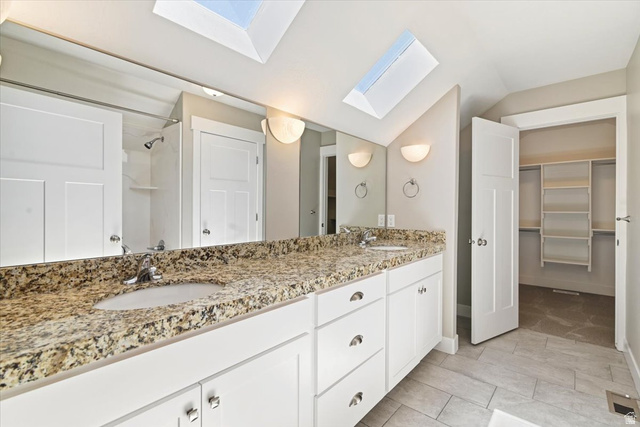 857 225 South Springville, UT 84663 - Photo 13 of 23 Master bath. Dual vanity with granite countertop, white cabinetry, and skylights