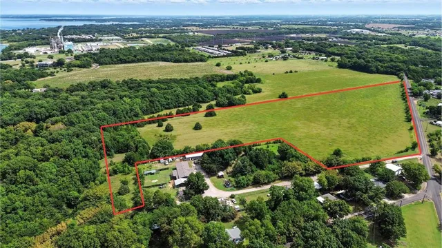 an aerial view of a houses with a yard