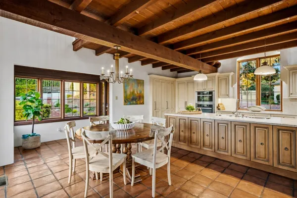 a spacious bedroom with a bed and a fireplace