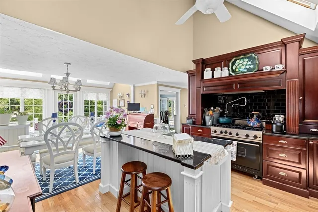 a kitchen with stainless steel appliances granite countertop a sink and cabinets