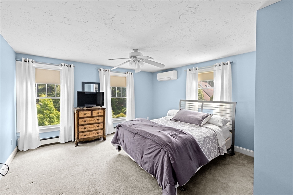 39 High Beacon Way Marshfield, MA 02050 - Photo 16 of 23 a bedroom with a bed and a television