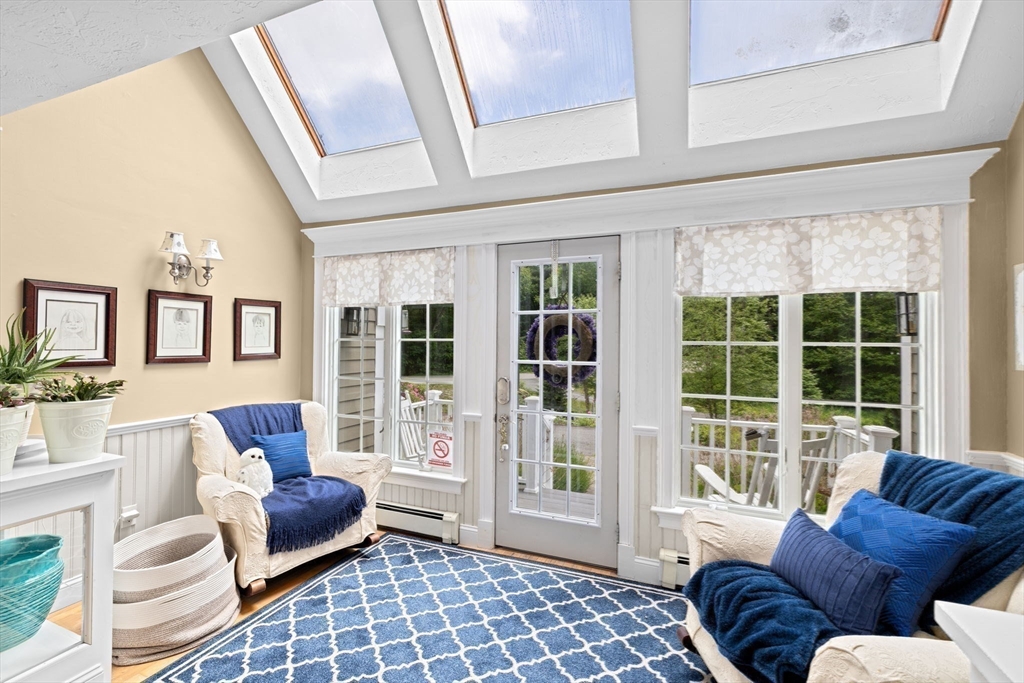 39 High Beacon Way Marshfield, MA 02050 - Photo 3 of 23 a living room with furniture and floor to ceiling windows