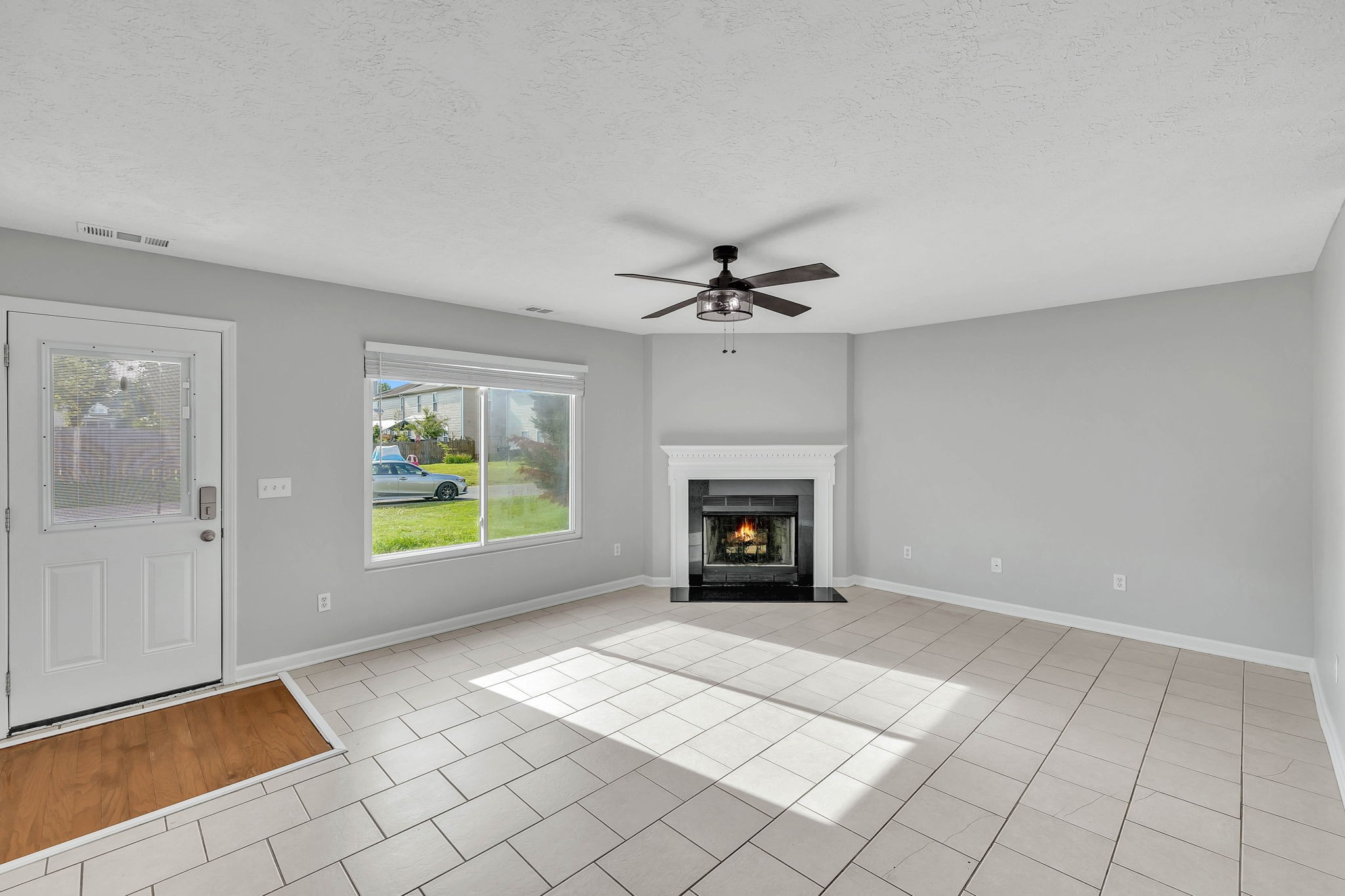 3418 Blaze Drive Murfreesboro, TN 37128 - Photo 13 of 46 a view of an empty room with a fireplace and a window