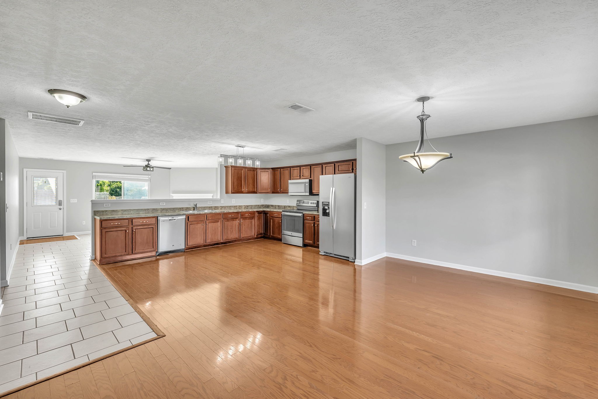 3418 Blaze Drive Murfreesboro, TN 37128 - Photo 4 of 46 a large kitchen with stainless steel appliances granite countertop a large counter top and a stove