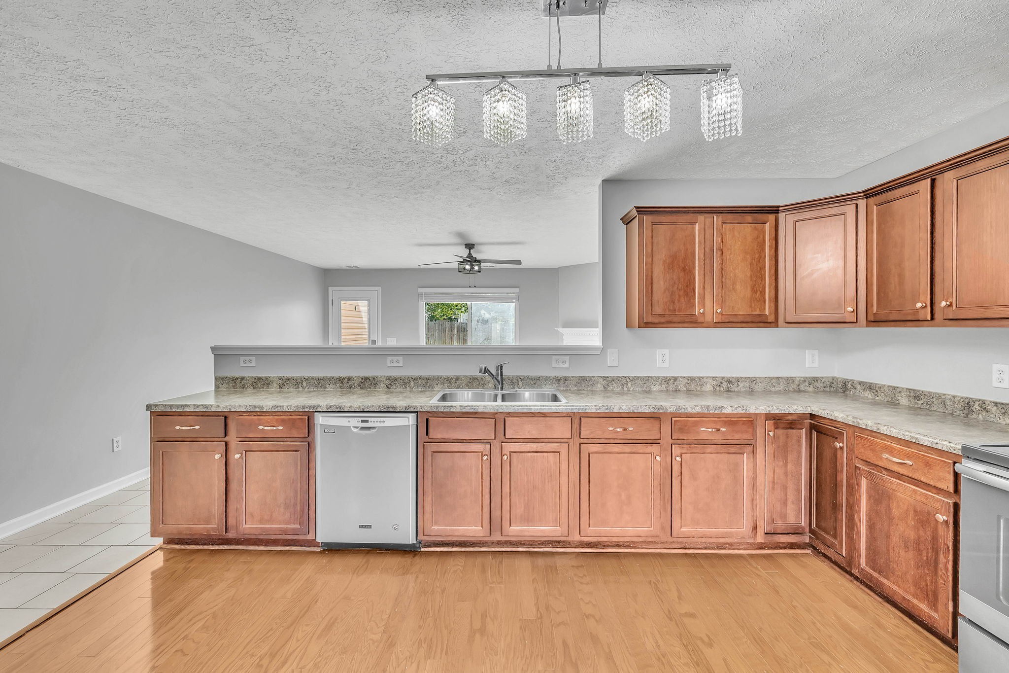 3418 Blaze Drive Murfreesboro, TN 37128 - Photo 9 of 46 a kitchen with stainless steel appliances granite countertop a stove cabinets and chandelier