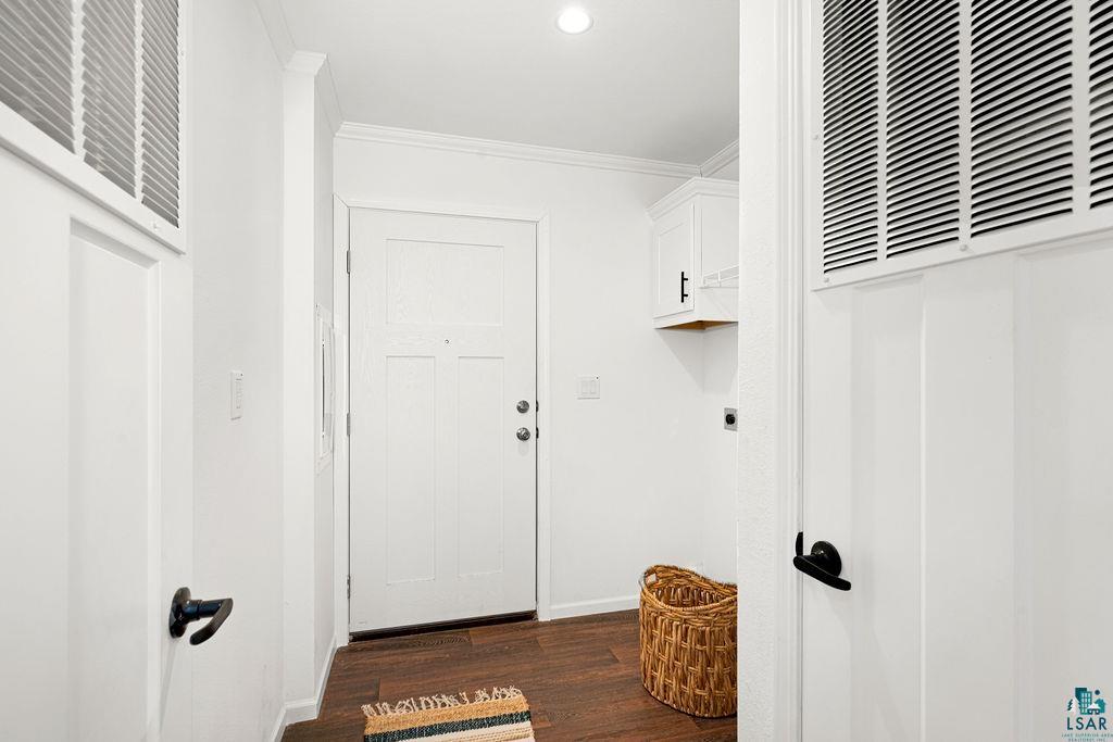 415 Cumming Avenue Superior, WI 54880 - Photo 12 of 26 Laundry area featuring ornamental molding, dark wood-style flooring, recessed lighting, cabinet space, and electric panel