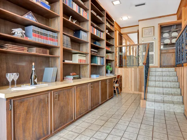 a bed room with a bed and a large window