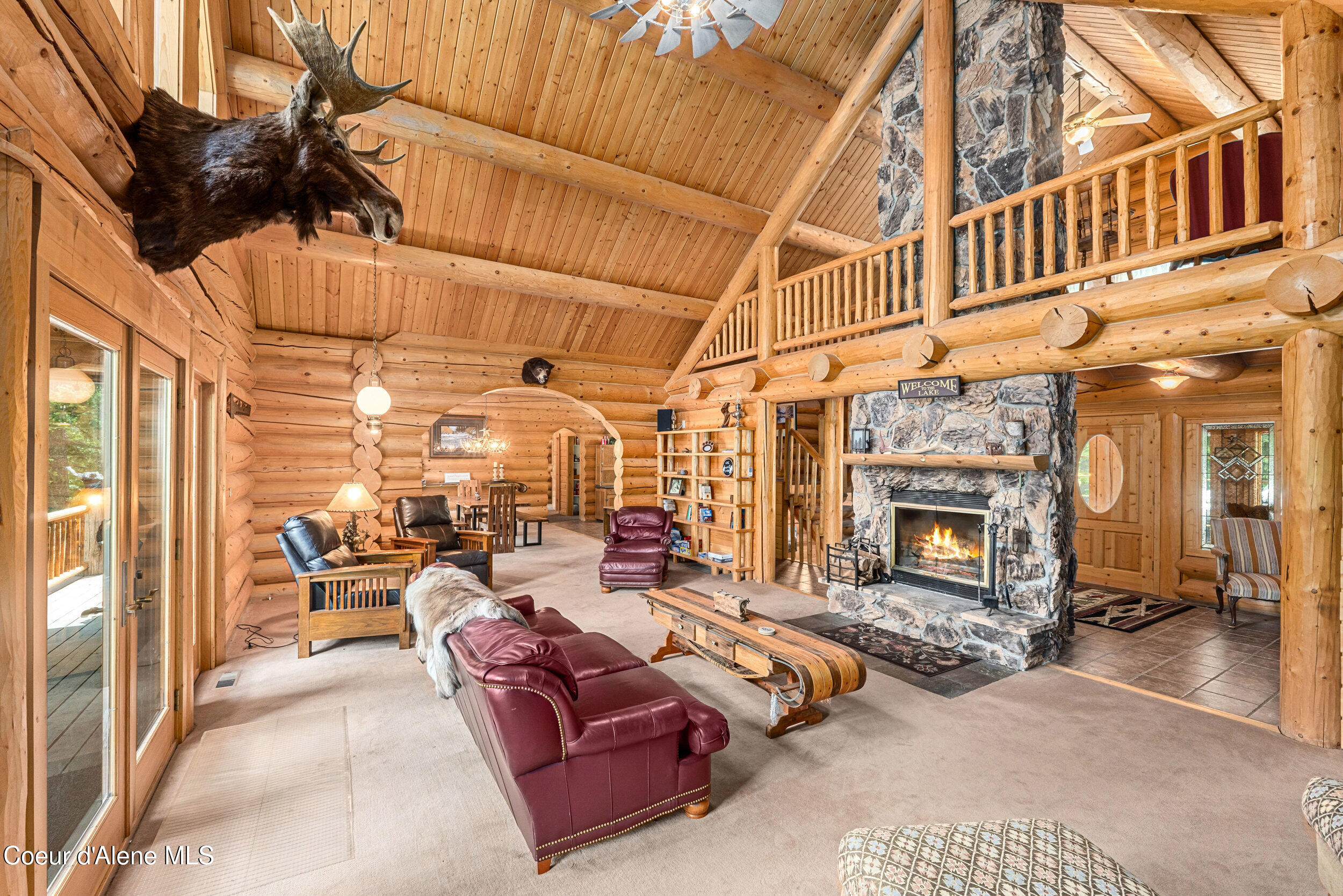 287 Cougar Run Road Priest River, ID 83856 - Photo 13 of 56 Great room with stone fireplace