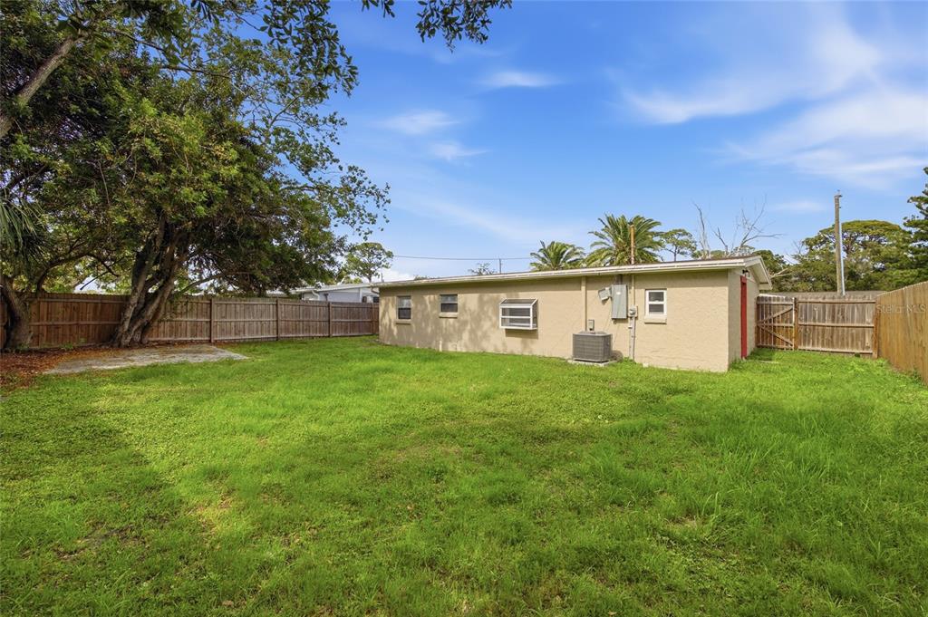 6629 Sierra Terrace New Port Richey, FL 34652 - Photo 19 of 30 a view of a backyard with a garden