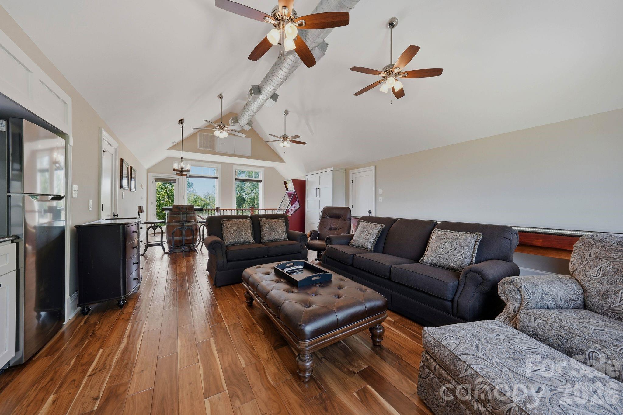 605 Recore Rdg Road Bessemer City, NC 28016 - Photo 30 of 47 a living room with furniture kitchen view and a wooden floor