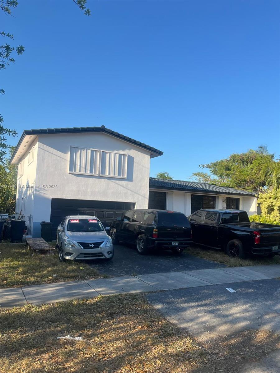 a car parked in front of a house