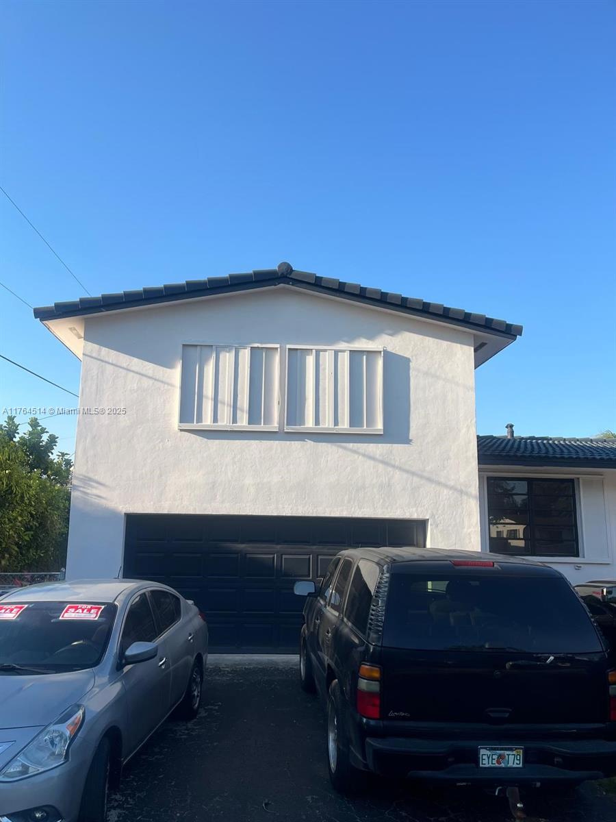 9971 Colonial Drive Miami, FL 33157 - Photo 2 of 7 a car parked in front of a house